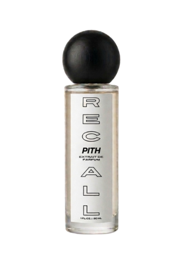 A clear glass bottle of Pith Recall Extrait de Parfum with a black spherical cap, shown against a solid white background.